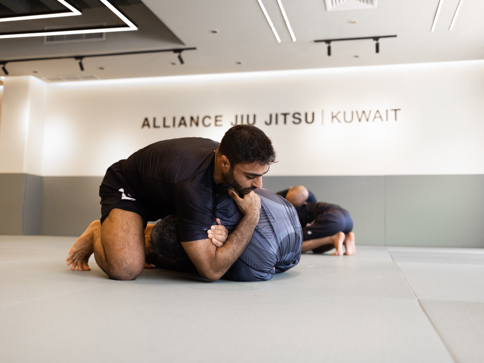 Alliance Kuwait athletes preparing for competition on the mats