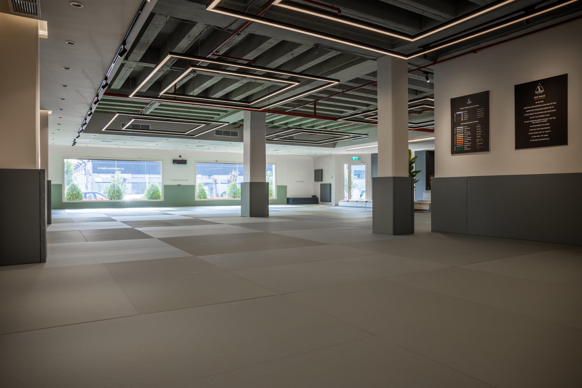 The empty mat room with natural light at Alliance Kuwait